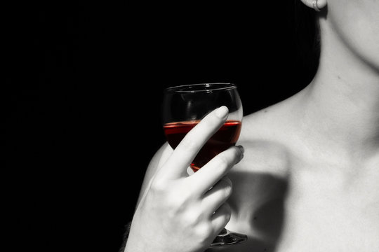 Red wine in a female hand