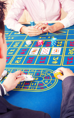Man playing poker in casino