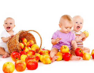 Fototapeta na wymiar babies playing with apples