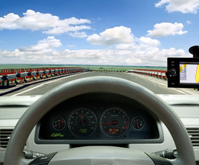 navigation system . car on the road among fields
