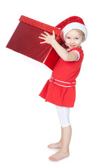 Pretty little girl in santa helper hat with big red gift on whit