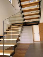 Modern glass, metal and wooden staircase