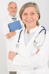 Fototapeta premium Medical doctor team seniors smiling hold folders