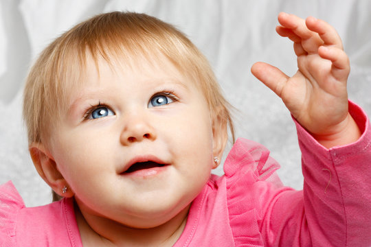 Baby Girl Looking Up at Light