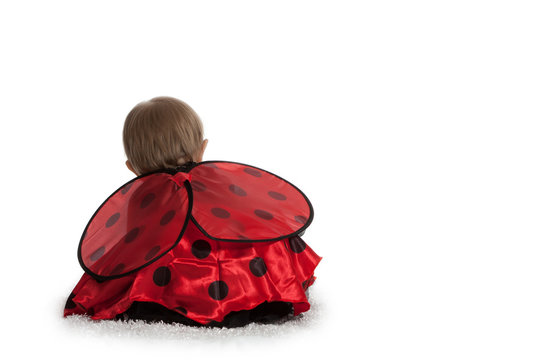 Girl Dressed Up as Lady Bug from Behind
