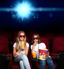 Two young girls in cinema