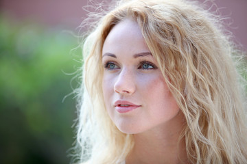 Portrait of beautiful blond smiling woman