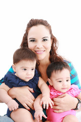 Happy young mother with two babies on a white background.