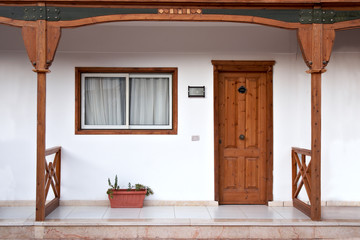 View of facade with door, window and railing