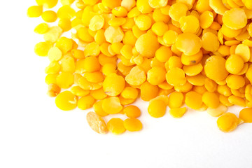 Yellow lentils isolated on white background.Macro shot