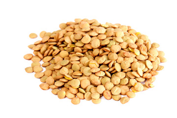 Brown lentils scattered on white background