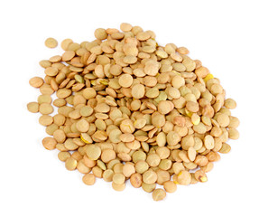 Brown lentils scattered on white background
