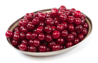 Bowl with ripe cherries. Isolated on a white background.