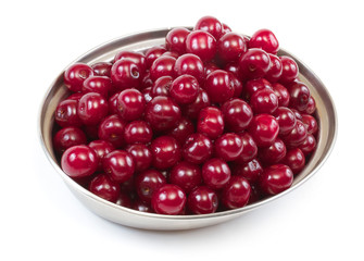 Bowl with ripe cherries. Isolated on a white background.
