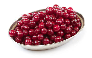 Bowl with ripe cherries. Isolated on a white background.