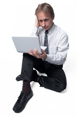 Portrait of middle-aged man with a white laptop computer