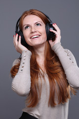 happy young woman listening to music