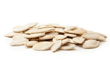 Pumpkin seeds on the white background