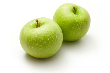 Green apples on the white background