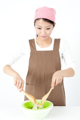 attractive asian woman cooking