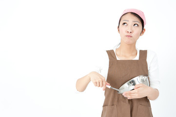 attractive asian woman cooking