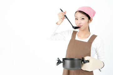 attractive asian woman cooking