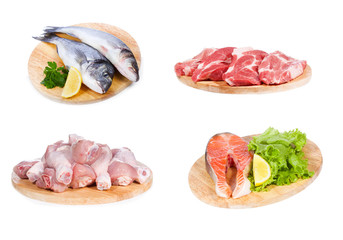 set with different raw fish, chicken and meat