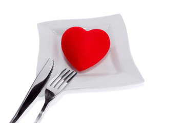 A heart health concept - red heart, plate, knife and fork