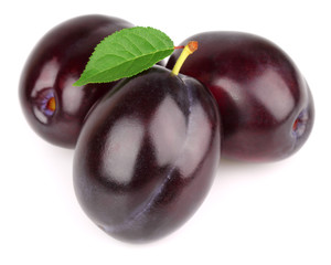 Sweet ripe plums with leaves