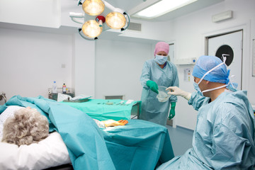 Surgical team performing operation