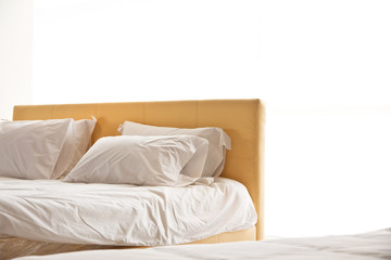 modern white bed and pillow in the morning mood