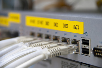 Ethernet cables connected to a Firewall