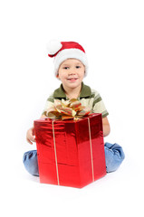 little boy in Santa Claus hat