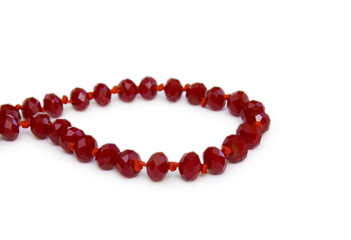 Necklace made of red beads isolated on white