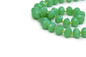 Necklace made of green beads isolated on white