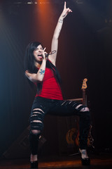 Female pop singer performing on stage