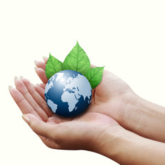 human hands holding blue earth with a leaf isolated