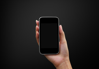 Mobile phone in hand on black background