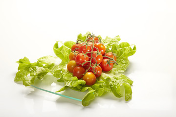 lettuce and tomatoe salad in a glass dish