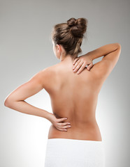 Woman massaging pain back