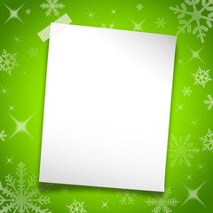 White paper on the surface of green christmas