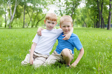 Naklejka na ściany i meble Portrait of two boys outdoors
