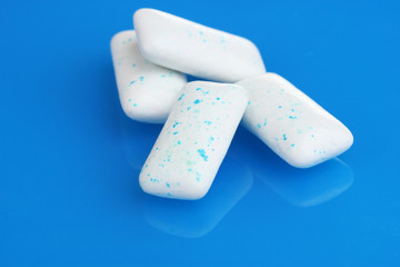 chewing gums on blue background