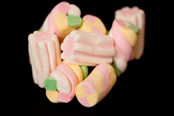 sweet colorful marshmallows on black background