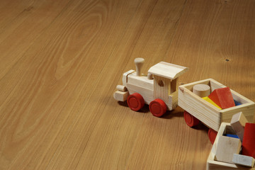 woodden train toy on parquet.