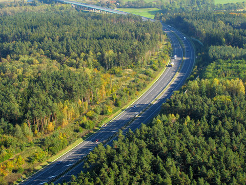 Aerial photo of a highway going through the forest