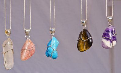 Jewelry chains on neck with stones sold in fair.
