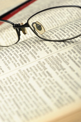 Eyeglasses on the old opren book