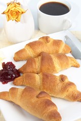 Breakfast of fresh croissants and coffee
