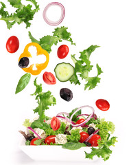 Fresh salad with vegetable in motion.
